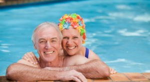 Happy mature couple in the swimming pool gambia